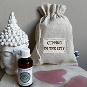 Rose quartz face and body gua sha set with massage oil and cotton pouch by Cupping in the City.